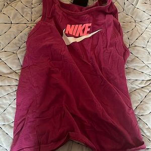 This is a Nike pink tank top for kids